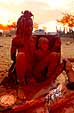 Himba mother and child at fire