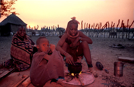 Himba family cooking supper