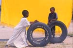 Children playing with tires