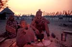 Himba family cooking supper