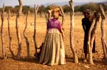 Herero woman talking to Himba shepherd 