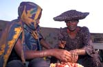 Herero mother and daughter selling meat 